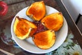 Pumpkin cut into quarters on a plate