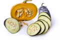 Pumpkin and eggplant on white background with water droplets.