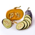 Pumpkin and eggplant on white background with water droplets.