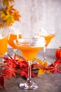 Pumpkin fall seasonal drink cocktail latte with spices and whipped cream for Thanksgiving or Halloween party festive celebrate. Royalty Free Stock Photo