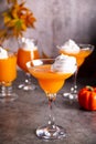 Pumpkin fall seasonal drink cocktail latte with spices and whipped cream for Thanksgiving or Halloween party festive celebrate. Royalty Free Stock Photo