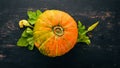 Pumpkin. Fresh vegetables. On a white wooden background. Free space for text. Royalty Free Stock Photo