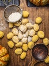 Pumpkin gnocchi Ingredients for cooking on ÃÂutting board on dark rustic background close up top view Royalty Free Stock Photo