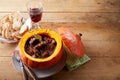 Pumpkin with goulash near bread and wine Royalty Free Stock Photo