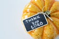 Pumpkin with a handwritten note: \