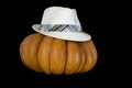 Pumpkin with hat isolated on black