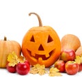 Pumpkin head, apples and yellow maple leaves isolated on white . Halloween holiday