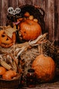 Pumpkin heads and autumn props wooden background