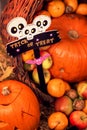 Pumpkin heads and autumn props wooden background