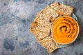 Pumpkin hummus seasoned with olive oil and black sesame seeds with whole grain crackers. Healthy vegetarian appetizer or snack. Royalty Free Stock Photo