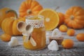 Pumpkin jam with oranges on a vintage wooden table Royalty Free Stock Photo