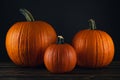 Pumpkin. Large and small pumpkins on natural wooden table. Pumpkin good for carving a Jack o Lantern on Halloween.