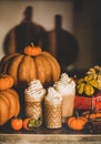 Pumpkin latte coffee decorated with whipped cream in glasses Royalty Free Stock Photo