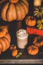 Pumpkin latte coffee drink topped with whipped cream and cinnamon Royalty Free Stock Photo