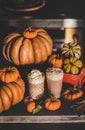 Pumpkin latte coffee drink topped with whipped cream in glasses Royalty Free Stock Photo