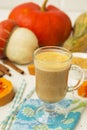 Pumpkin latte - coffee with pumpkin cream and hot drinks. Royalty Free Stock Photo