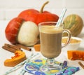 Pumpkin latte - coffee with pumpkin cream and hot drinks. Royalty Free Stock Photo