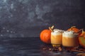 Pumpkin latte drink. Autumn coffee with spicy pumpkin flavor and cream on a dark background. Seasonal Fall Drinks for Halloween