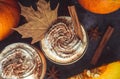 Pumpkin latte drink. Autumn coffee with spicy pumpkin flavor and cream on a dark background. Seasonal Fall Drinks for Halloween Royalty Free Stock Photo