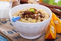 Pumpkin millet porridge with apple and raisins Royalty Free Stock Photo