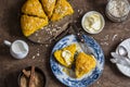 Pumpkin oat scones on wooden table, top view.