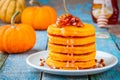 Pumpkin pancakes with maple syrup and pecan Royalty Free Stock Photo