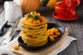 Pumpkin pancakes with mint leaves and sauce on the old wooden background. Rustic style. Royalty Free Stock Photo