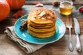 Pumpkin pancakes with butter, honey and nuts Royalty Free Stock Photo