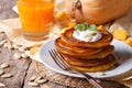 Pumpkin pancakes with sour cream and juice