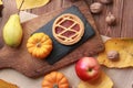 pumpkin pie and fresh autumn fruits and vegetables close-up on the table Royalty Free Stock Photo