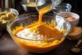 pumpkin pie preparation: mixing ingredients in bowl