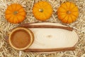 Pumpkin pie and pumpkins and spice with straw hay background with wood sign Royalty Free Stock Photo