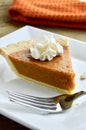 Pumpkin pie on a white plate Royalty Free Stock Photo