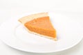 Pumpkin pie on white plate Royalty Free Stock Photo