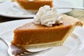 Pumpkin pie on a white plate Royalty Free Stock Photo