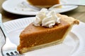 Pumpkin pie on a white plate Royalty Free Stock Photo