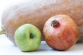 Pumpkin pomegranate apple on white background