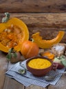 Pumpkin porridge in a clay bowl with pumpkin and apple