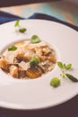 Pumpkin and potatoes gnocchi with mushrooms sauce