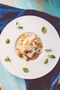 Pumpkin and potatoes gnocchi with mushrooms sauce