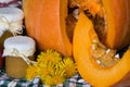 Pumpkin and pumpkin jam, puree or sauce on green with white tablecloth. Autumn still life. Royalty Free Stock Photo