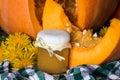 Pumpkin puree or sauce on background of pumpkin. Autumn still life Royalty Free Stock Photo