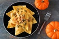 Pumpkin ravioli pasta, overhead scene on slate Royalty Free Stock Photo