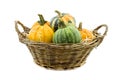 Pumpkin in reed basket isolated on white