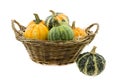 Pumpkin in reed basket and one in front