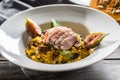 Pumpkin risotto roasted duck breast figs zucchini and min leaves. italian or mediterranean cuisine