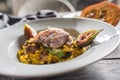 Pumpkin risotto roasted duck breast figs zucchini and min leaves. italian or mediterranean cuisine