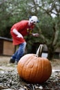 Pumpkin and scary evil clown Royalty Free Stock Photo