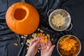 Pumpkin seed harvesting, womanÃ¢â¬â¢s hands sorting seeds and pumpkin guts