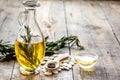 Pumpkin seed oil with ingredients on kitchen table background mock up